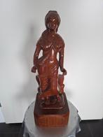 Balinees houtsnijwerk vrouw, Ophalen