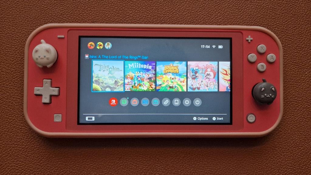 Nintendo Switch Lite roze met 10 games en extras, Ophalen of Verzenden, Roze of Coral, Gebruikt
