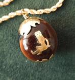 14 karaat gouden hanger Djucu Koeienoog, Sieraden, Tassen en Uiterlijk, Kettinghangers, Overige voorstellingen, Bruin, Verzenden