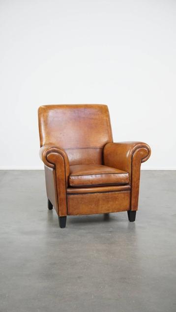 Comfortabele en grote vintage schapenleren fauteuil/armchair beschikbaar voor biedingen