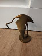 Messing kraanvogel beeldje, Ophalen