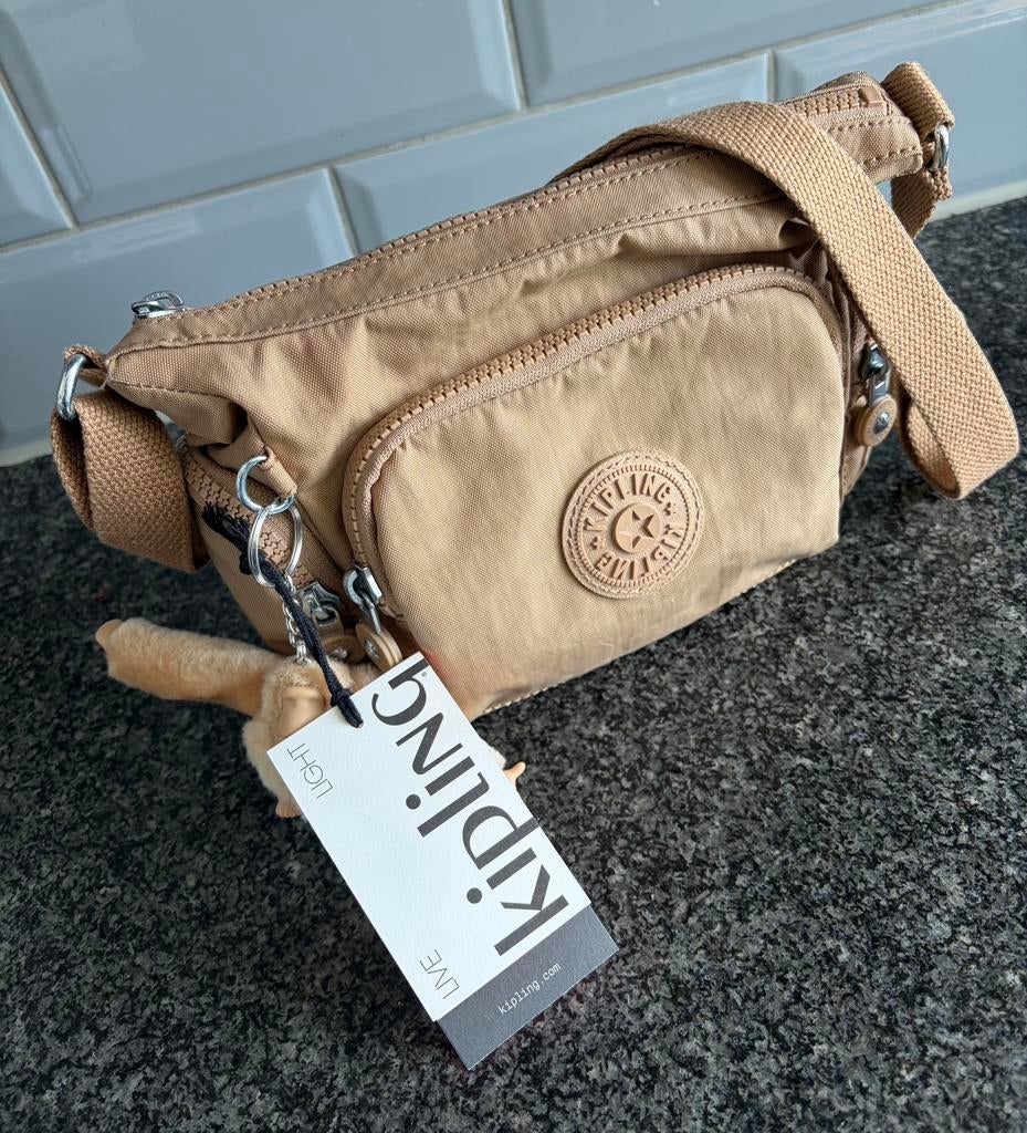 Kipling Gabbie Mini kleur goudbruin, Sieraden, Tassen en Uiterlijk, Tassen | Damestassen, Ophalen of Verzenden, Zo goed als nieuw