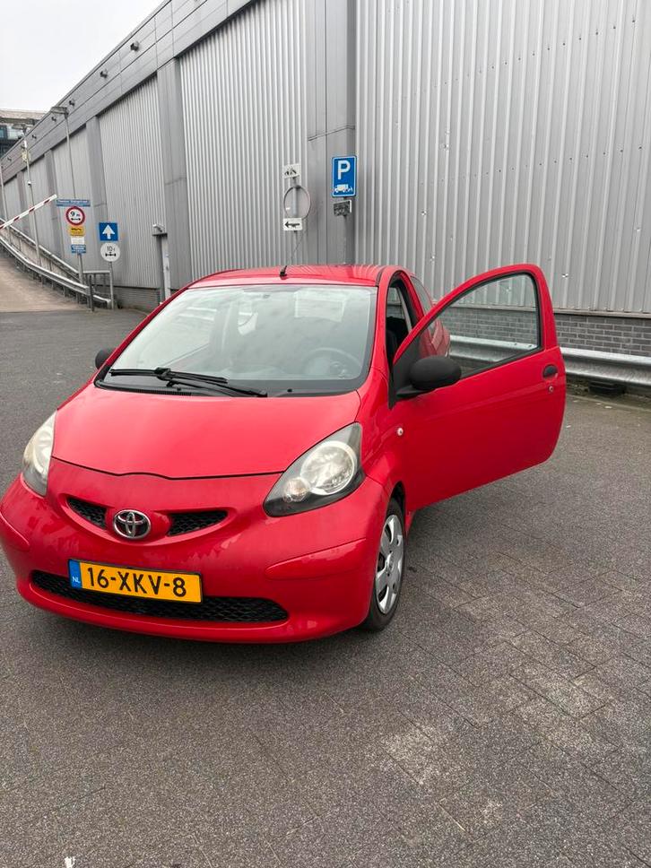 Toyota Aygo 114km nette goed onderhouden., Sieraden, Tassen en Uiterlijk, Zonnebrillen en Brillen | Heren, Rood, Ophalen of Verzenden