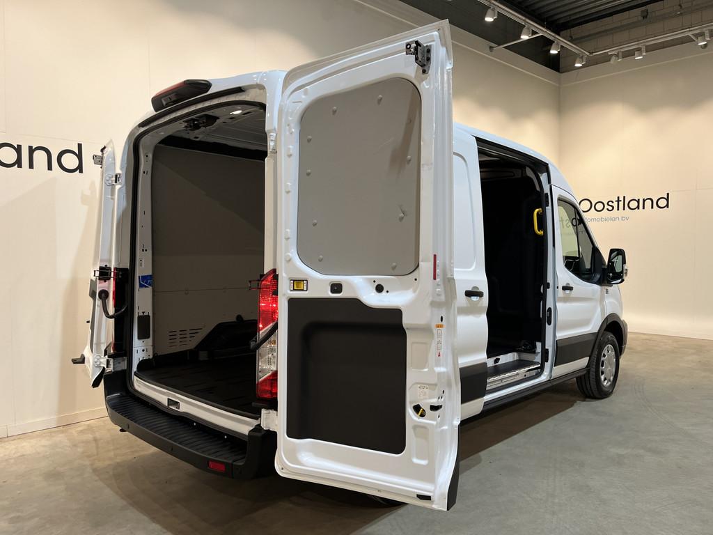 Ford E-Transit 390 (3500 kg) L2H2 Trend 68 kWh / 100% Elektr, Auto's, Bestelauto's, Automaat, Gebruikt, Zwart, Met garantie (alle)