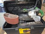 Hitachi bandschuurmachine SB 10V2 in Stanley koffer, Ophalen of Verzenden, Gebruikt, 600 tot 1200 watt, Bandschuurmachine