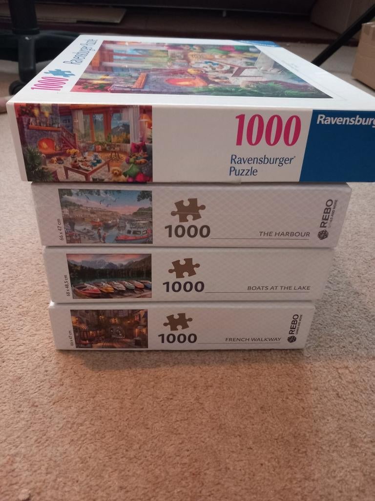 4 puzzels van 1000 stukjes, Rebo en Ravensburger, Ophalen of Verzenden, 500 t/m 1500 stukjes, Zo goed als nieuw, Legpuzzel