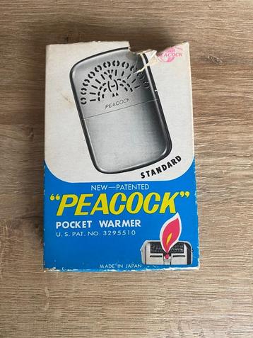 Peacock handwarmer beschikbaar voor biedingen
