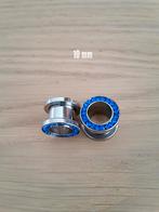 Nieuwe tunnels, pluggen. Staal. Blauwe steentjes. 6, 8 mm., Ophalen of Verzenden, Zo goed als nieuw, Staal, Oor- of Traguspiercing