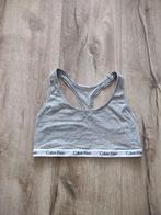 Mooie grijze sportbeha van Calvin Klein, maat M. Sporttop., Kleding | Dames, Ondergoed en Lingerie, Calvin Klein, Ophalen of Verzenden