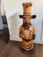 Massief houten varken, Ophalen