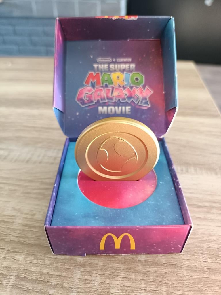 Super Mario Galaxy Movie Gouden Munt McDonald's, Kinderen en Baby's, Speelgoed | Overig, Zo goed als nieuw, Jongen of Meisje, Ophalen of Verzenden