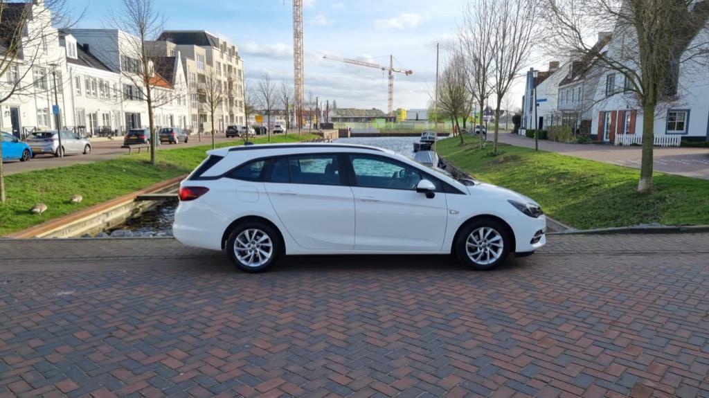 Opel Astra 1.2 Turbo 110pk Start/stop 2020 met nieuwe motor!, Auto's, Opel, Voorwielaandrijving, Stof, 1199 cc, Wit