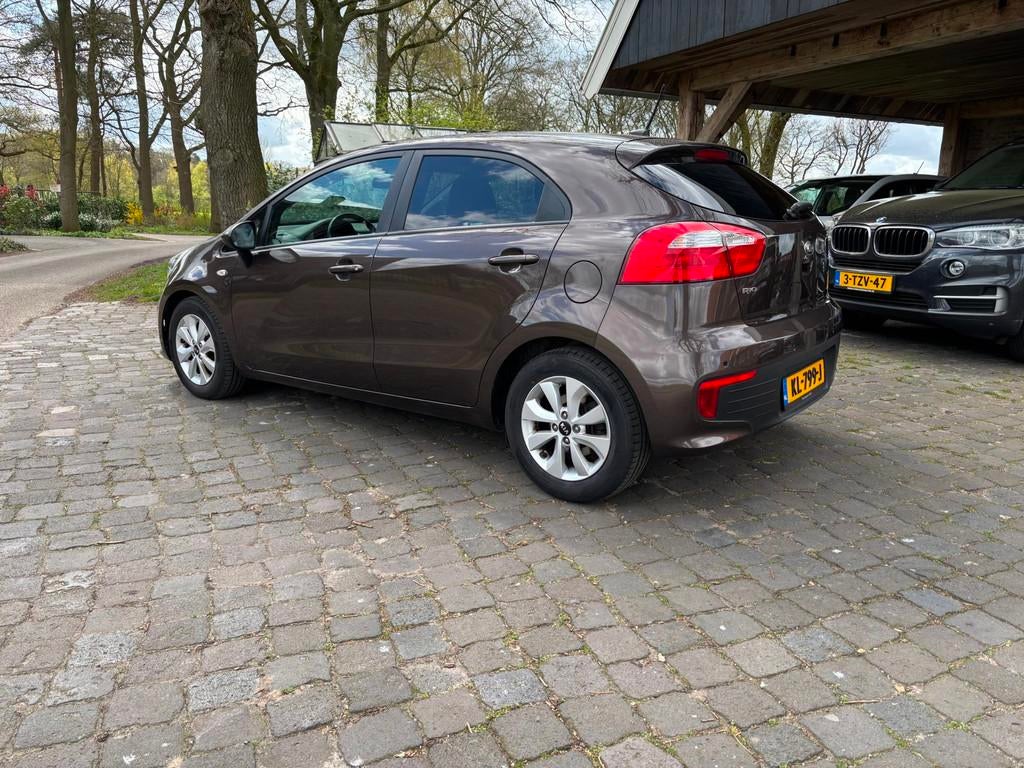 Kia Rio 1.2 CVVT ComfortPlusLine Navigator, 4 cilinders, Bruin, Bedrijf, Handgeschakeld