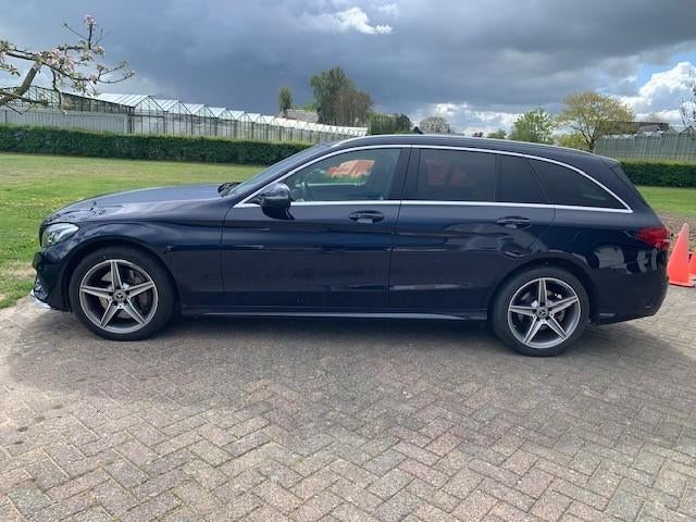 Mercedes-Benz C-Klasse C400 333pk 4MATIC 9G-TRONIC 2018, Auto's, Mercedes-Benz, 1800 kg, Zwart, Blauw, 2996 cc
