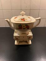 Antieke theepot met lichtjeshouder, Ophalen