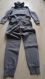 Puma Trainingspak Jongens Maat M - Grijs, Kleding | Heren, Overige Herenkleding, Ophalen of Verzenden, Zo goed als nieuw, Puma