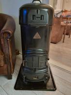 Hout- en kolen/briketten kachel, Ophalen