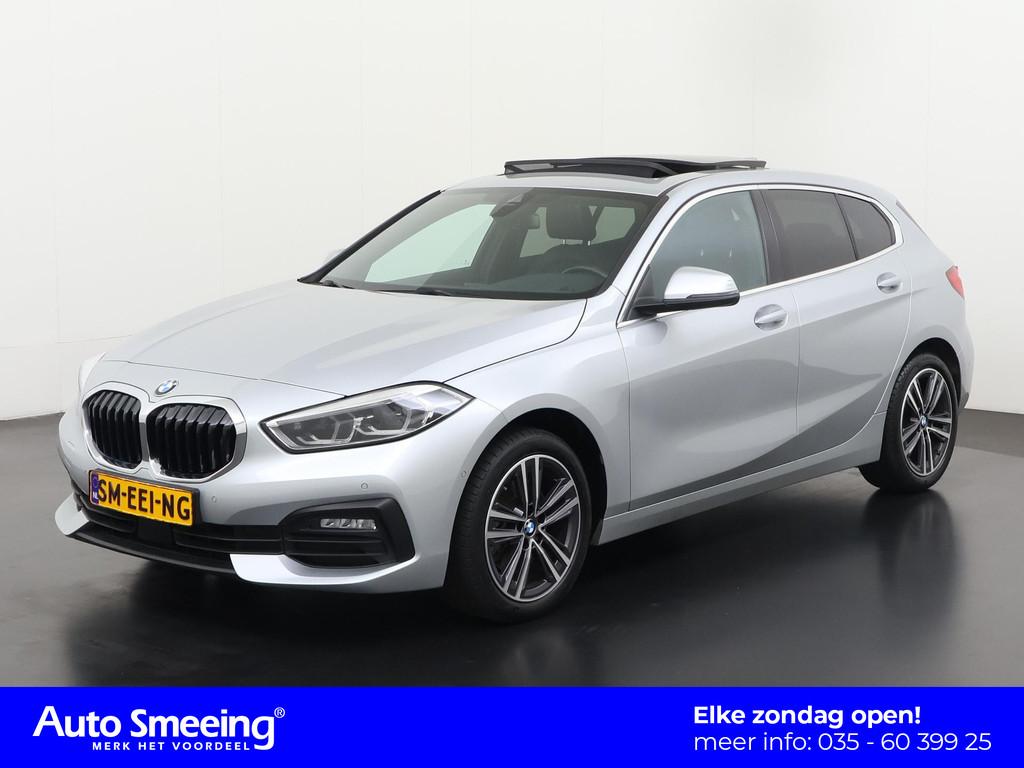 BMW 1 Serie 118i Business Design | Panoramadak | Leder | Cam, Auto's, 12 maanden, Gebruikt, Lichtsensor, Leder