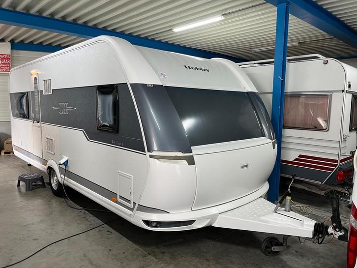 Hobby De luxe 560 CFE VERKOCHT, Caravans en Kamperen, Caravans, Bedrijf, tot en met 4, 1250 - 1500 kg, Hobby, 7 tot 8 meter, Hordeur
