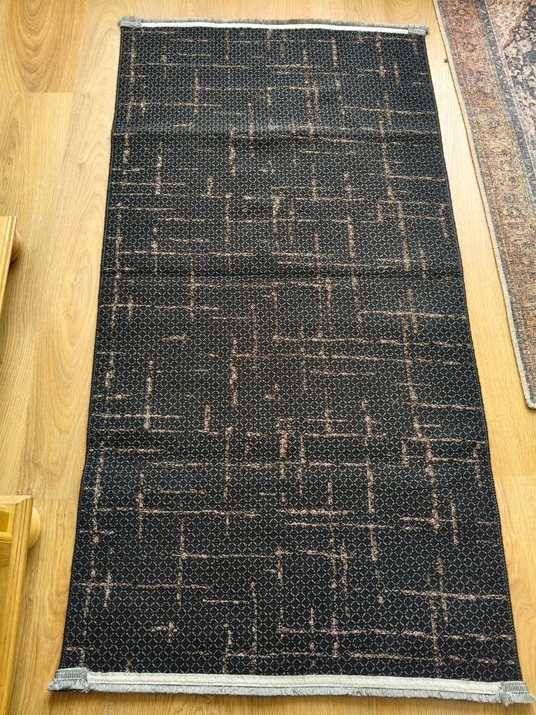 Modern vloerkleed 80x150 cm - Zwart met patroon, Ophalen, Gebruikt, 100 tot 150 cm, Bruin