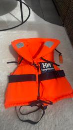 Helly Hansen oranje zwemvest kind 20-30 kilo, Watersport en Boten, Ophalen of Verzenden, Kind, Reddingsvest of Zwemvest