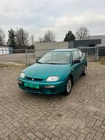 Mazda 323 1.5 Coupe LX 1997 Groen, Auto's, Mazda, Voorwielaandrijving, 1489 cc, 4 cilinders, 400 kg