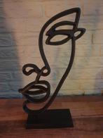 Metalen modern figuur, Ophalen