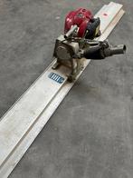 Beton trilspaan met Honda motor, Ophalen