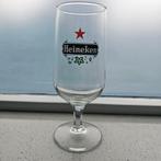 Oud Heineken glas op voet. Hoogte = 18 cm. Diameter = 6 cm., Ophalen of Verzenden, Nieuw, Glas of Glazen, Heineken