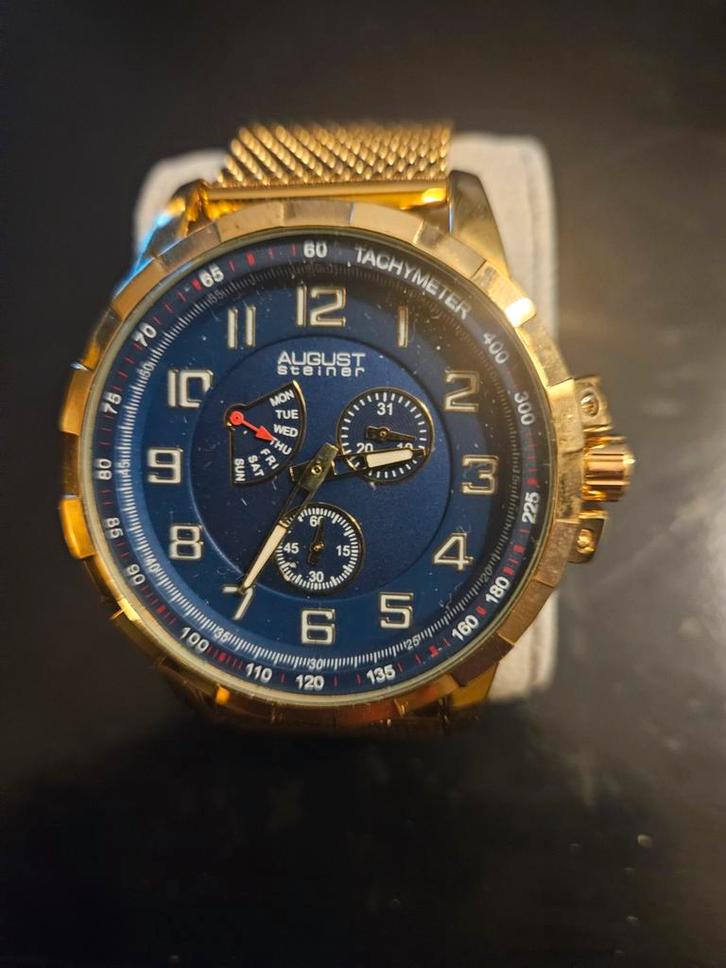 August Steiner Herenhorloge Goudkleurig met Blauwe Wijzerpla, Sieraden, Tassen en Uiterlijk, Horloges | Heren, Nieuw, Overige merken
