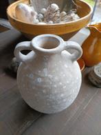 Sobere kruik met oren, Ophalen