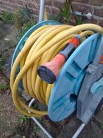 Tuinslang op haspel, gebruikt maar nog goed in orde, Tuin en Terras, Ophalen of Verzenden, Gebruikt, Tuinslang