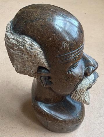 Hoofd van Afrikaanse man (Shona, Zimbabwe), serpentijn beschikbaar voor biedingen