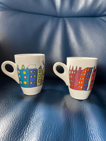 Yong grachtenpand koffie kopjes beschikbaar voor biedingen