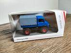 Te koop Schuco Unimog U406 Blauw Edition 1:64., Ophalen of Verzenden, Zo goed als nieuw, Hijskraan, Tractor of Landbouw, Schuco