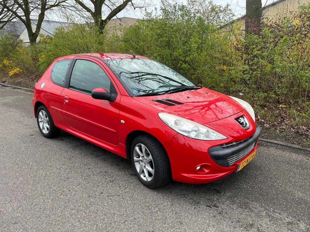 Peugeot 206+ 1.4 3D 2010 Rood, Auto's, Peugeot, Voorwielaandrijving, 206+, Stof, 4 cilinders