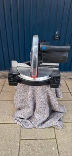 Ferm afkortzaag, Ophalen