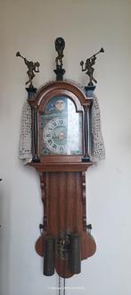 Friese staart klok, Ophalen