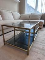 Connelly salontafel, messing en rookglas, gekocht bij MADE, Huis en Inrichting, Tafels | Salontafels, Ophalen, 100 tot 150 cm