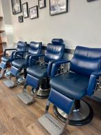 Vier blauwe kapper-stoelen