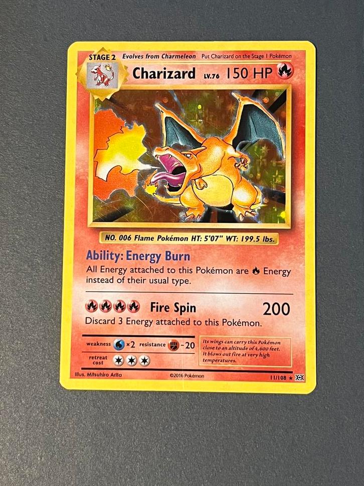 Charizard holo evolutions 11/108, Hobby en Vrije tijd, Verzamelkaartspellen | Pokémon, Zo goed als nieuw, Ophalen of Verzenden