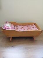 Houten poppenbed, Ophalen