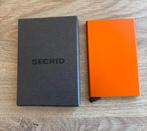 SECRID pasjeshouder oranje, Ophalen of Verzenden, Zo goed als nieuw, Oranje