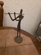 Bronzen beeldje van fluitspeler, Ophalen