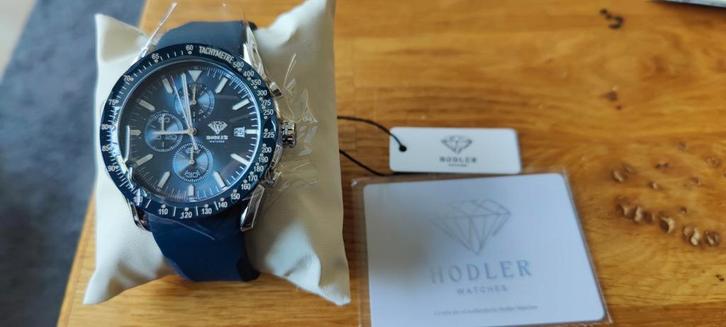 Hodler Horloge - Nieuw., Sieraden, Tassen en Uiterlijk, Horloges | Heren, Nieuw, Polshorloge, Overige merken, Staal, Kunststof