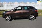 Hyundai Ix35 2.0i i-Catcher Automaat met Leder en Navigatie, Auto's, Hyundai, Lichtsensor, 4 cilinders, Bruin, 163 pk