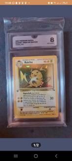Raichu holo first edition fossil #14 Graded 8, Ophalen of Verzenden, Zo goed als nieuw, Losse kaart, Foil