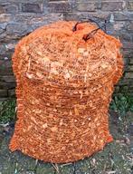 Houtsnippers in zak, Ophalen