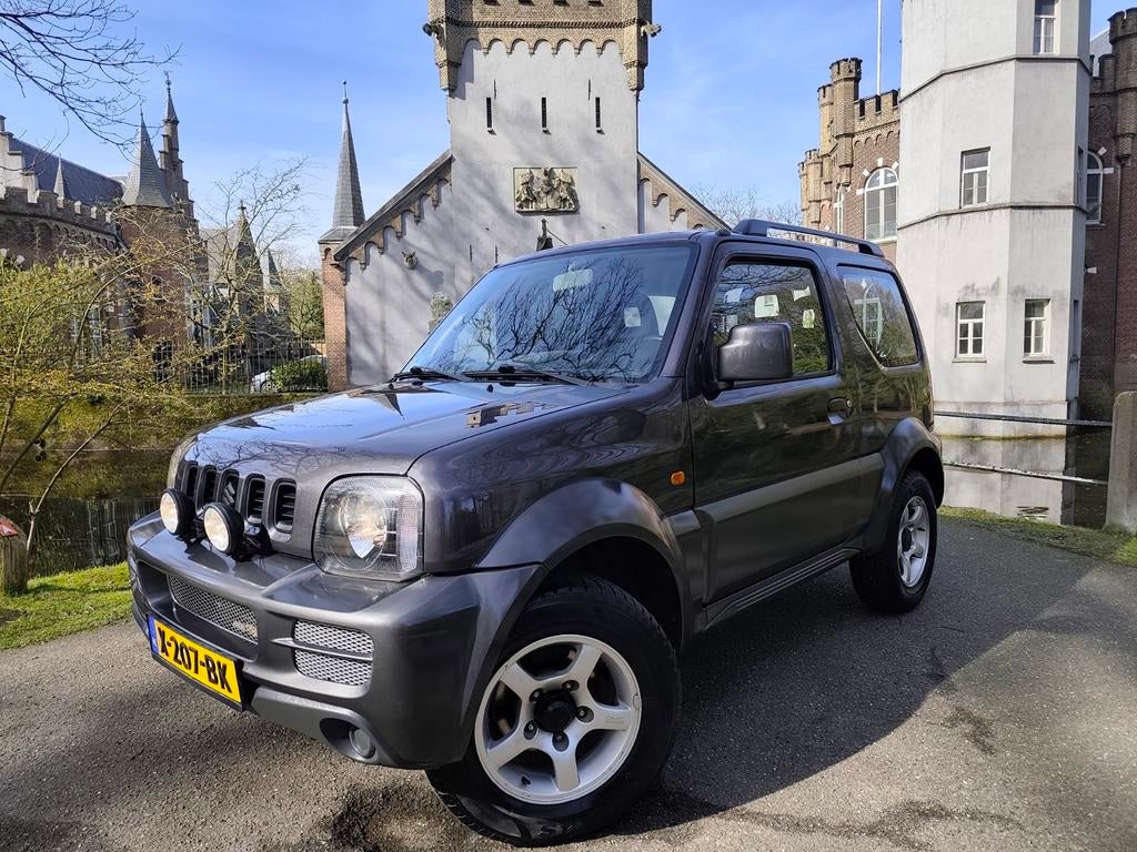 Suzuki Jimny 1.3 4x4 / airco / trekhaak / Android auto / NAP, Stof, 40 €/maand, Zwart, 4 stoelen
