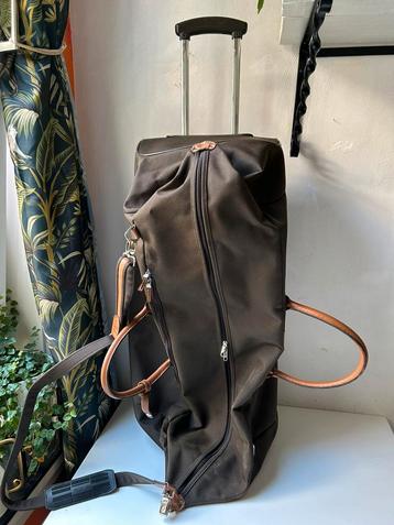 Samsonite reistas met wieltjes en leren handvatten beschikbaar voor biedingen